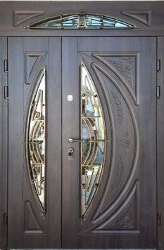 Вхідні вуличні двері з фрамугою склопакетами і ковкою MDF17-2 фото